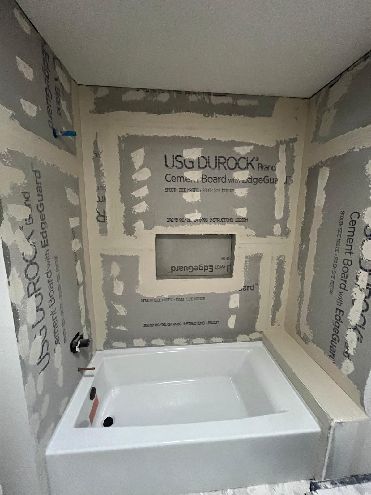 Bathroom tub surround before tile installation with wall board preparation